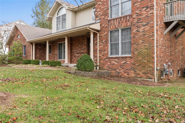 view of home's exterior with a yard