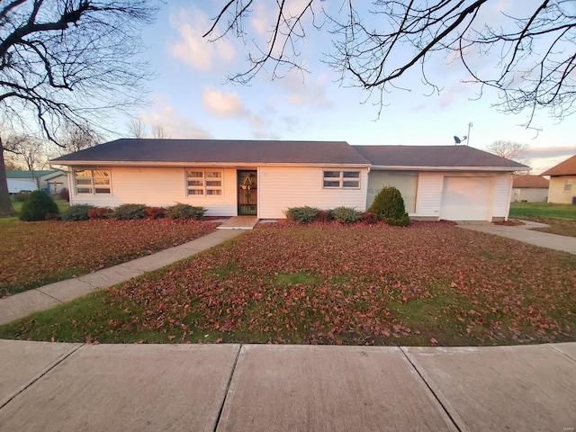 single story home featuring a garage