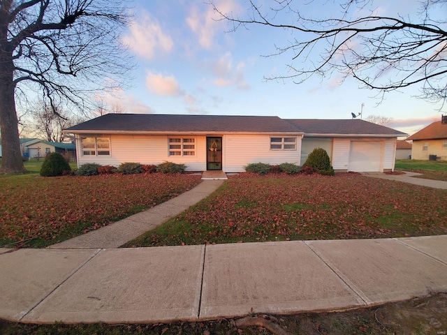 ranch-style house featuring a garage