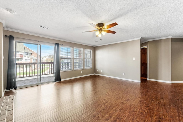 spare room featuring dark hardwood / wood-style floors, ceiling fan, crown molding, and a textured ceiling