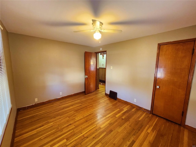 unfurnished bedroom featuring ceiling fan and light wood-type flooring