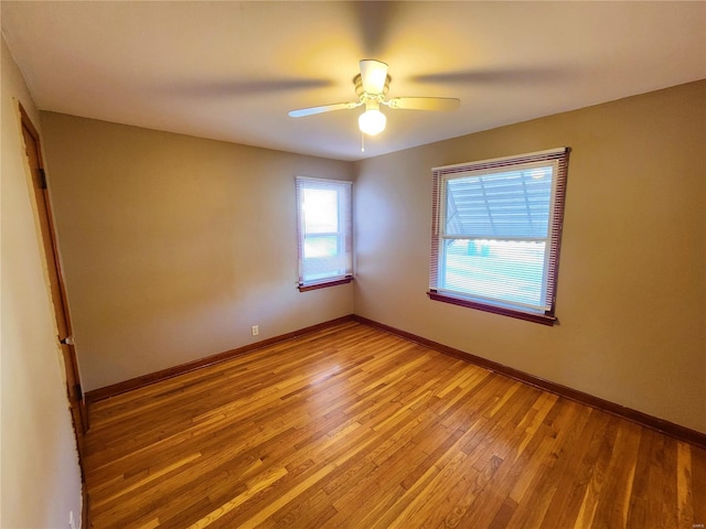 spare room featuring ceiling fan and light hardwood / wood-style floors