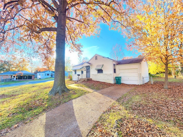 single story home with a front lawn and a garage