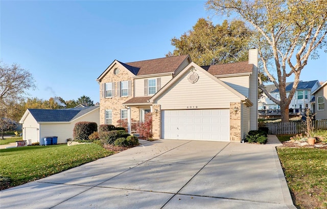 front of property featuring a garage and a front lawn