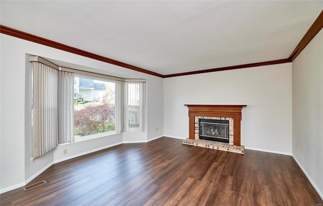 unfurnished living room with a fireplace, dark hardwood / wood-style floors, and ornamental molding