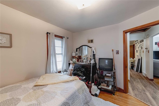 bedroom with light hardwood / wood-style floors