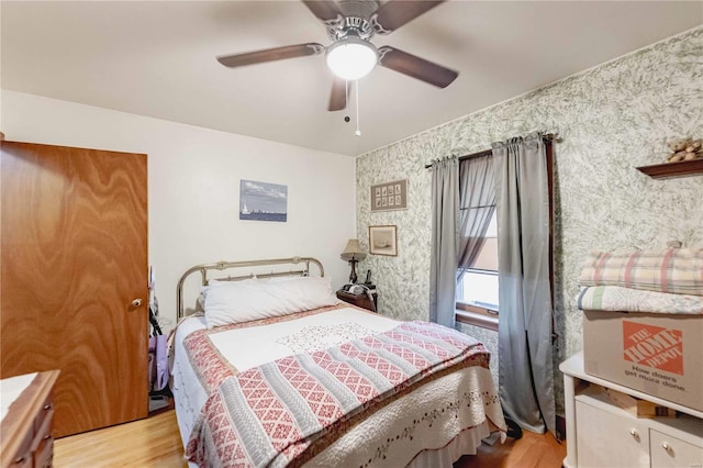 bedroom featuring ceiling fan and light hardwood / wood-style floors