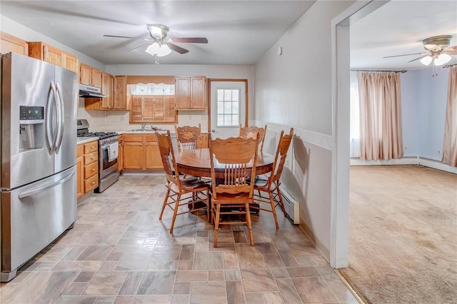 dining space with ceiling fan, light carpet, and a baseboard radiator