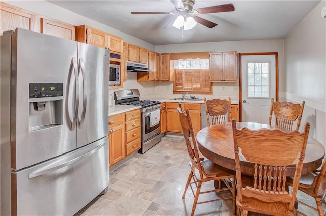 kitchen with ceiling fan, sink, stainless steel appliances, and light brown cabinets