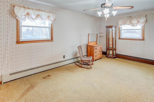 unfurnished room featuring carpet, ceiling fan, and a baseboard radiator