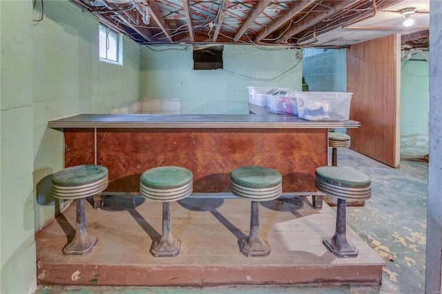 bar featuring concrete floors