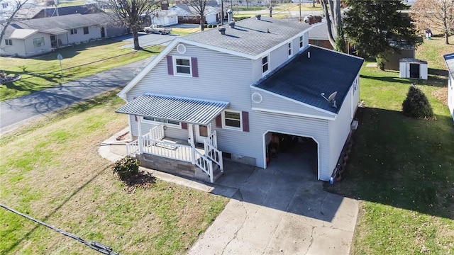 exterior space with a carport and a yard