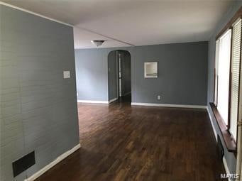 empty room featuring dark hardwood / wood-style floors