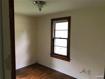 empty room featuring dark hardwood / wood-style floors