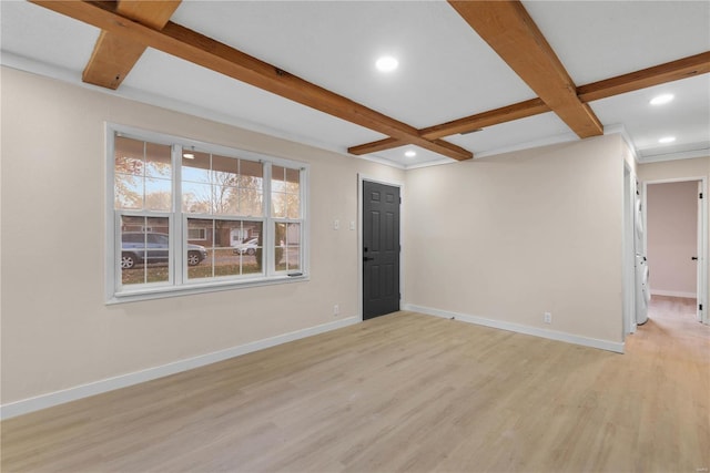 unfurnished living room with beamed ceiling, light hardwood / wood-style floors, and coffered ceiling