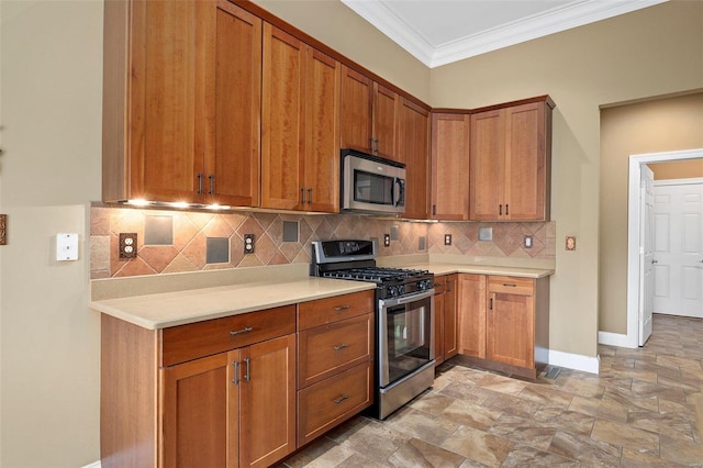 kitchen featuring appliances with stainless steel finishes, backsplash, and crown molding