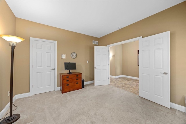 bedroom featuring light carpet