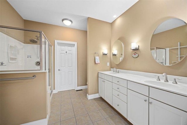 bathroom with tile patterned flooring, vanity, and an enclosed shower