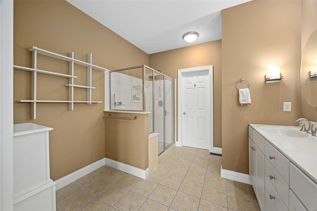 bathroom with tile patterned floors, vanity, and a shower with shower door