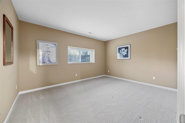 empty room with light colored carpet