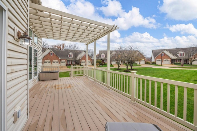 deck featuring a yard and a pergola