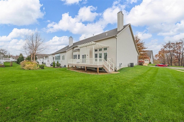 back of property featuring a pergola, a yard, central AC unit, and a deck