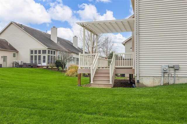 exterior space featuring a pergola and a wooden deck