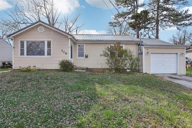 single story home with a garage and a front lawn