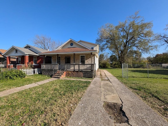 view of front facade with covered porch and a front yard