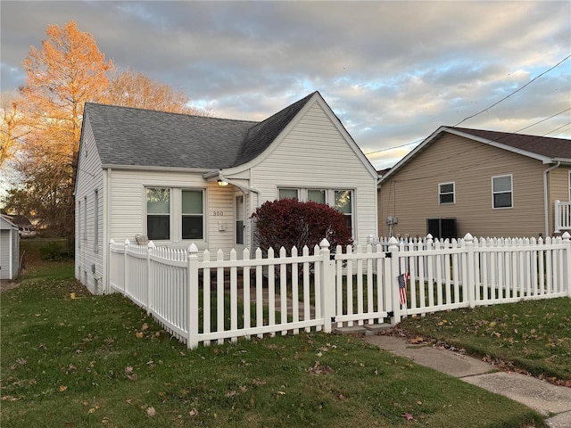 bungalow with a front yard