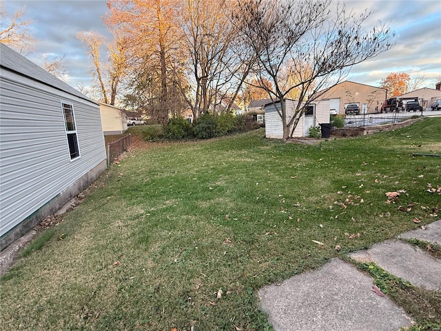 view of yard featuring a storage unit