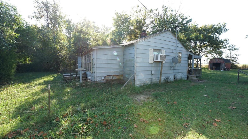 view of home's exterior featuring a lawn and cooling unit