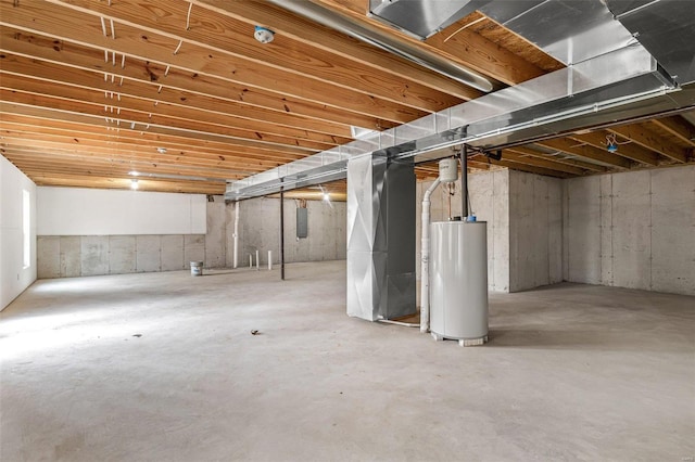 unfinished basement with electric panel and water heater