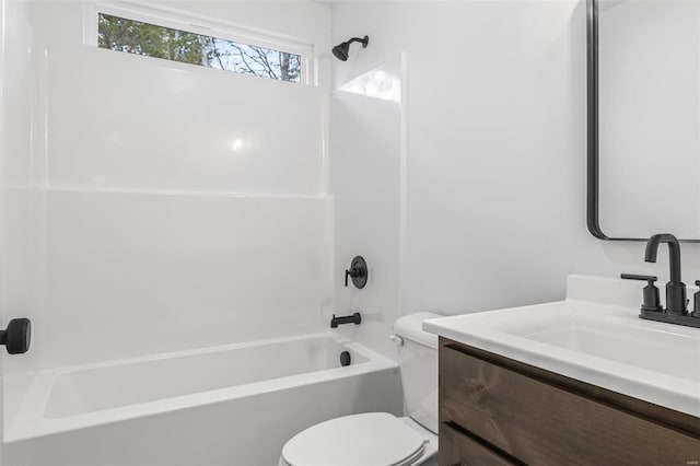 full bathroom featuring shower / bathing tub combination, vanity, and toilet