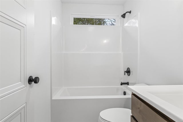 bathroom with shower / bathtub combination, vanity, and toilet