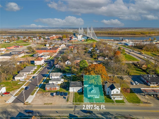 drone / aerial view with a residential view and a water view