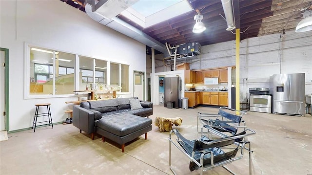 living room with a high ceiling