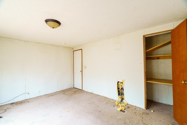 spare room with a textured ceiling