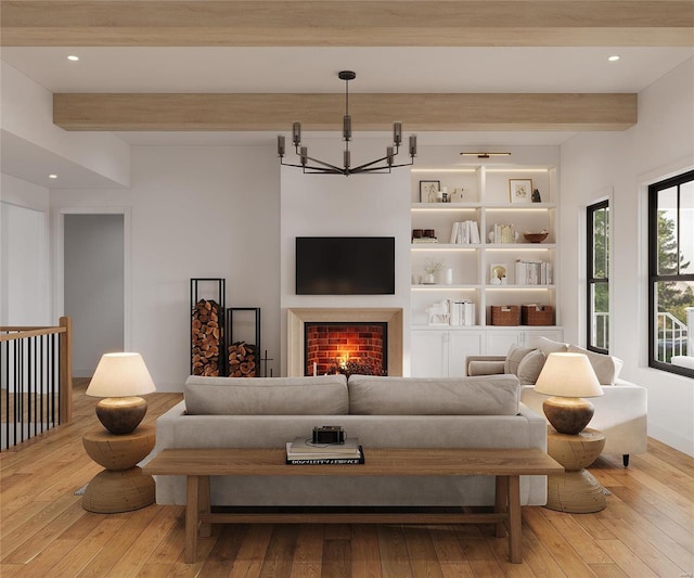 living room featuring beam ceiling, light hardwood / wood-style floors, and an inviting chandelier