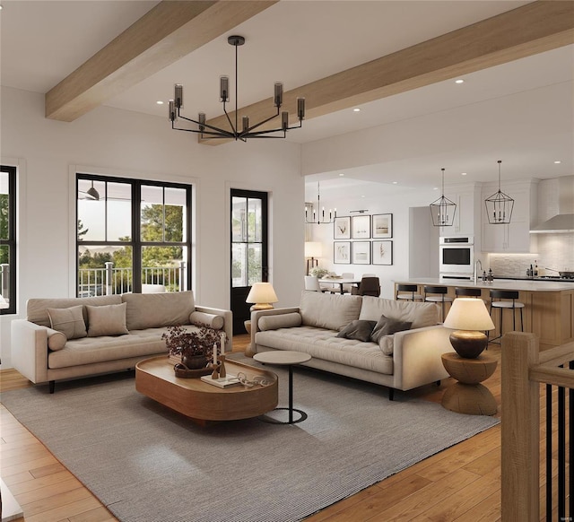 living room with beamed ceiling, a chandelier, and light wood-type flooring