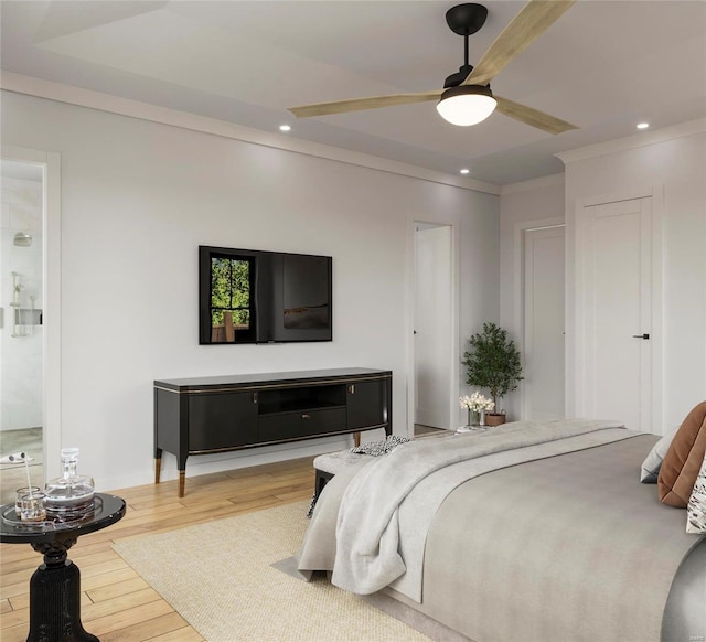 bedroom with hardwood / wood-style flooring, ceiling fan, and ornamental molding