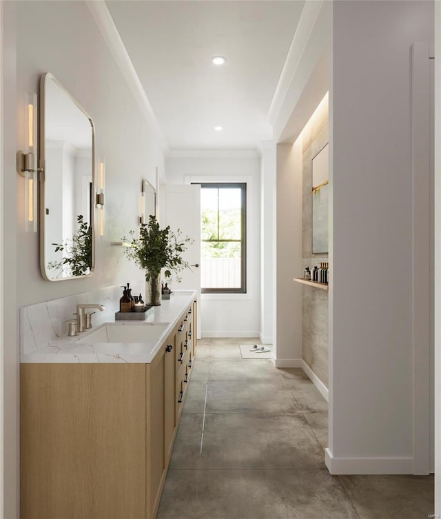 bathroom featuring vanity, concrete flooring, and ornamental molding