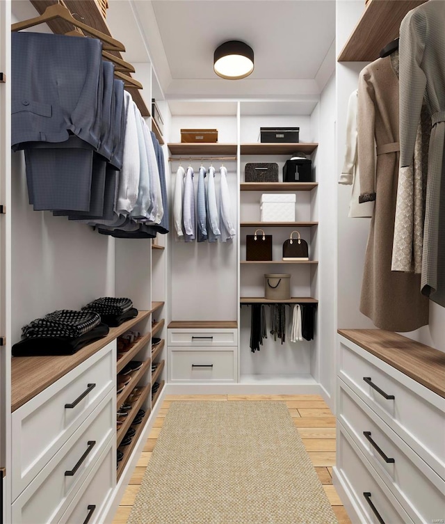 walk in closet with light wood-type flooring