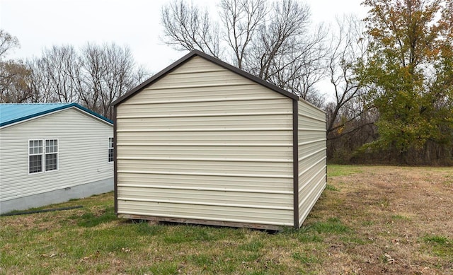 view of outdoor structure with a lawn