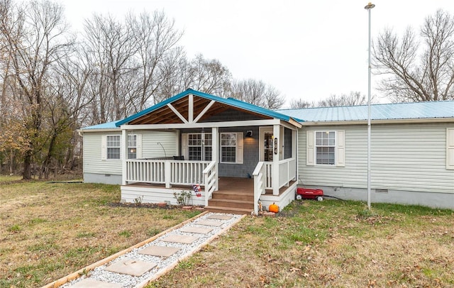 view of front of house featuring covered porch and a front lawn