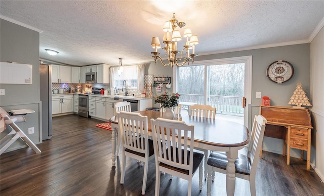 dining space featuring a chandelier, a textured ceiling, dark hardwood / wood-style flooring, and ornamental molding