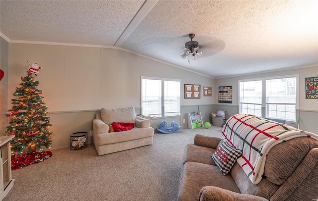 living room featuring a textured ceiling, carpet floors, ceiling fan, and lofted ceiling