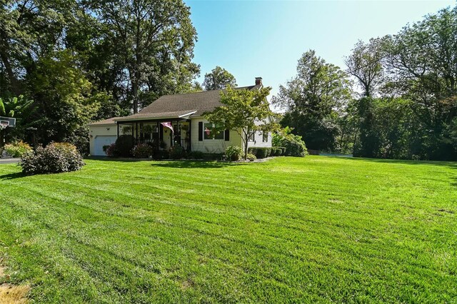 view of yard with a garage