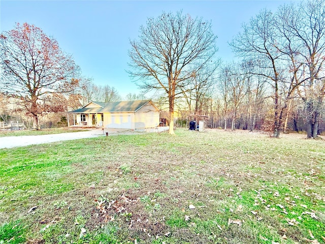 view of yard featuring a garage