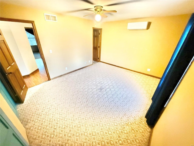 unfurnished room featuring ceiling fan and light carpet